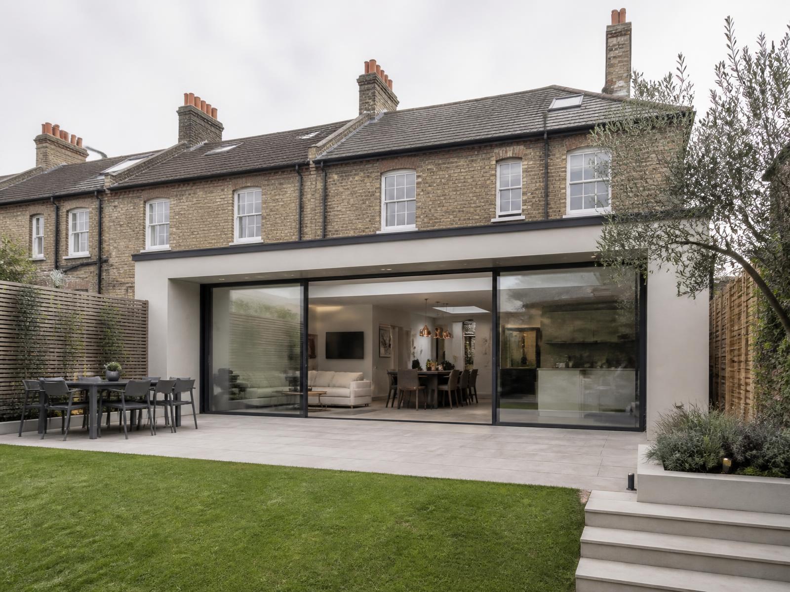 Single-storey rear extension with sliding glass doors on a Victorian brick house